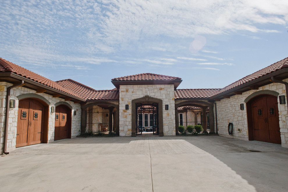 Design ideas for an expansive rustic entrance in Austin with terracotta flooring, a double front door and a metal front door.