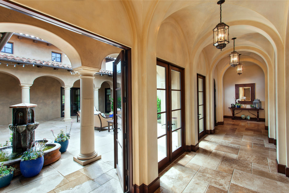 Example of a tuscan entryway design in Los Angeles