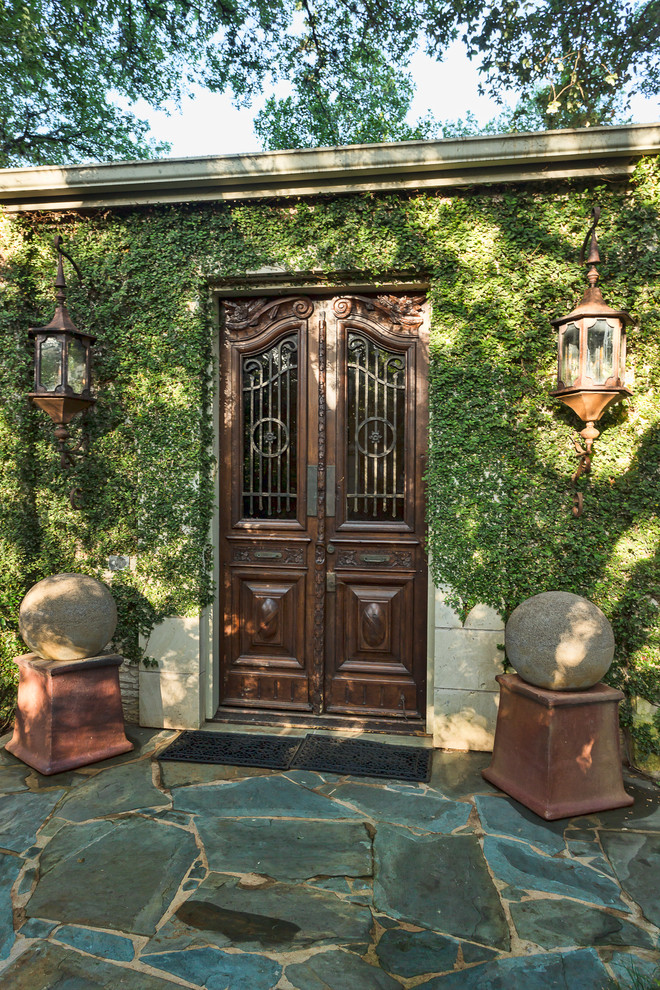 Double front door - traditional double front door idea in Austin with a dark wood front door