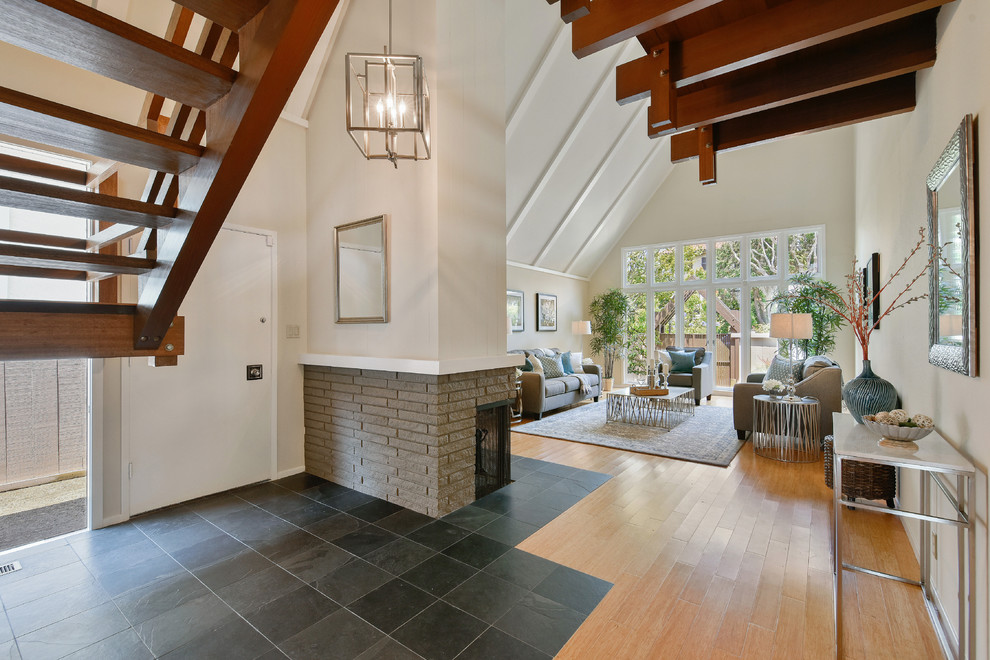 Example of a mid-sized 1950s bamboo floor single front door design in San Francisco with beige walls