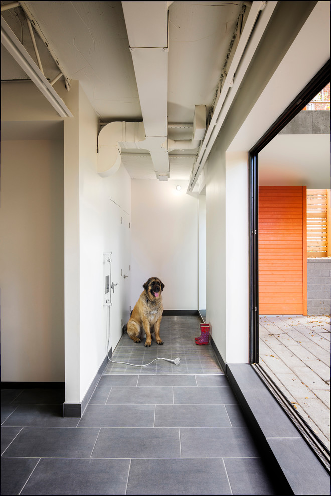 Inspiration for a contemporary entry hall remodel in Ottawa with white walls