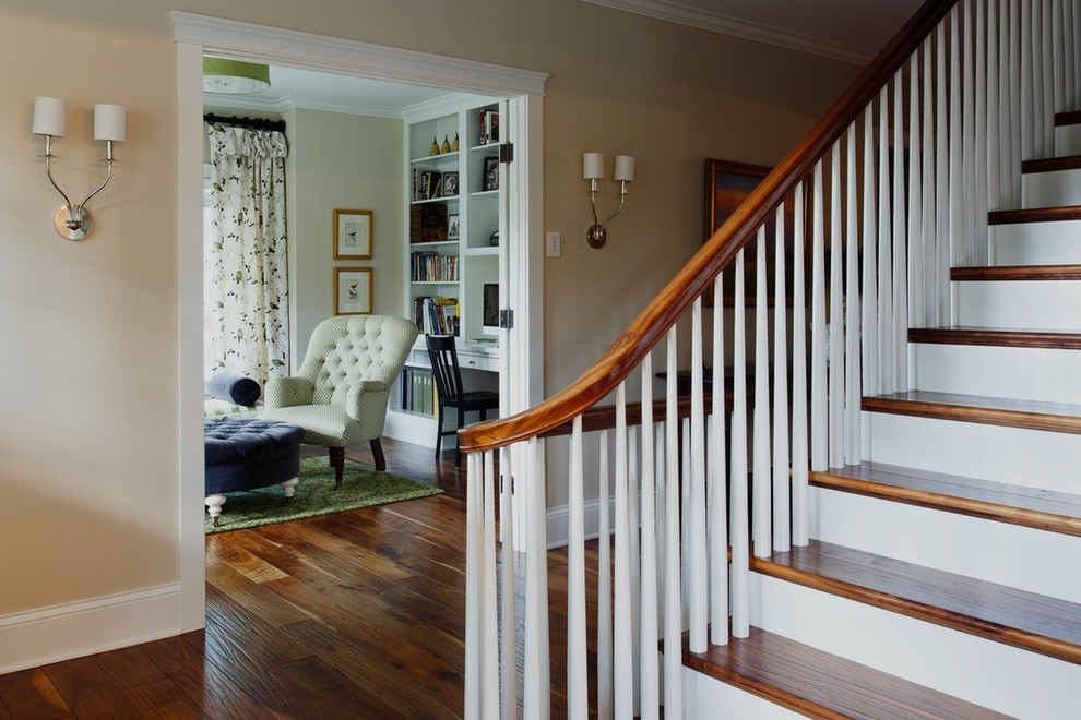 Inspiration for a large traditional foyer in Minneapolis with beige walls, medium hardwood flooring and brown floors.