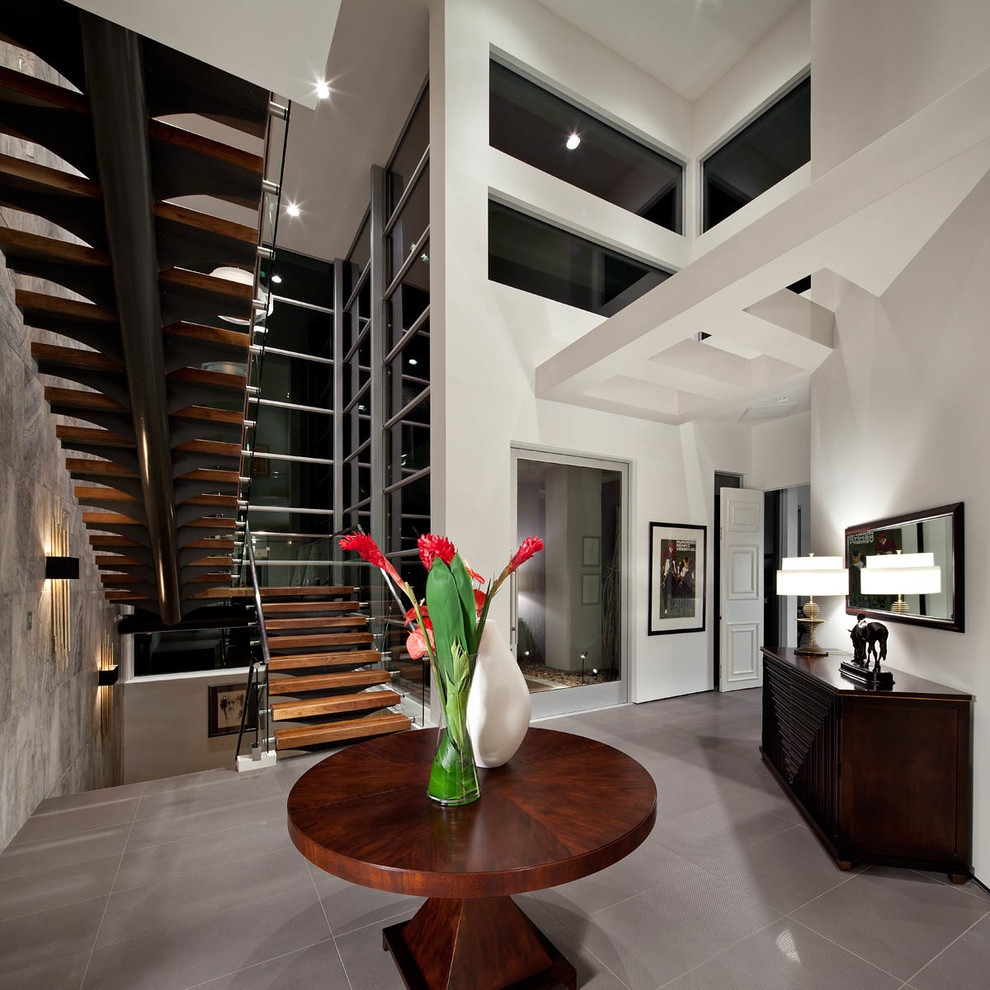 Inspiration for an expansive contemporary foyer in Orange County with white walls.