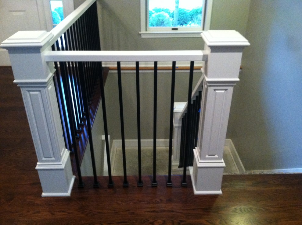 This is an example of a medium sized traditional staircase in Detroit.