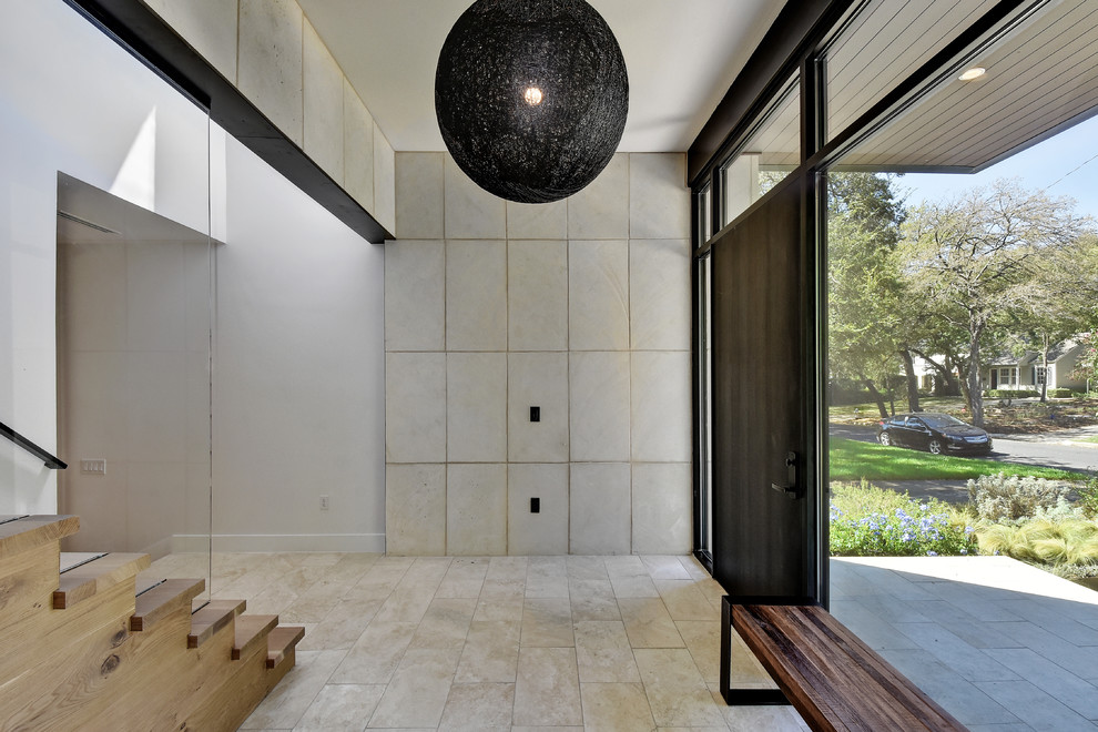 Inspiration for a contemporary foyer in Austin with a dark wood front door.
