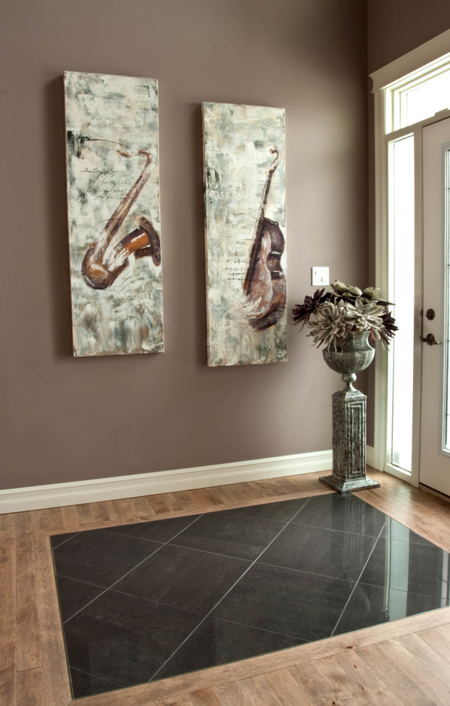 This is an example of a medium sized classic foyer in Calgary with grey walls, dark hardwood flooring, a single front door and a glass front door.