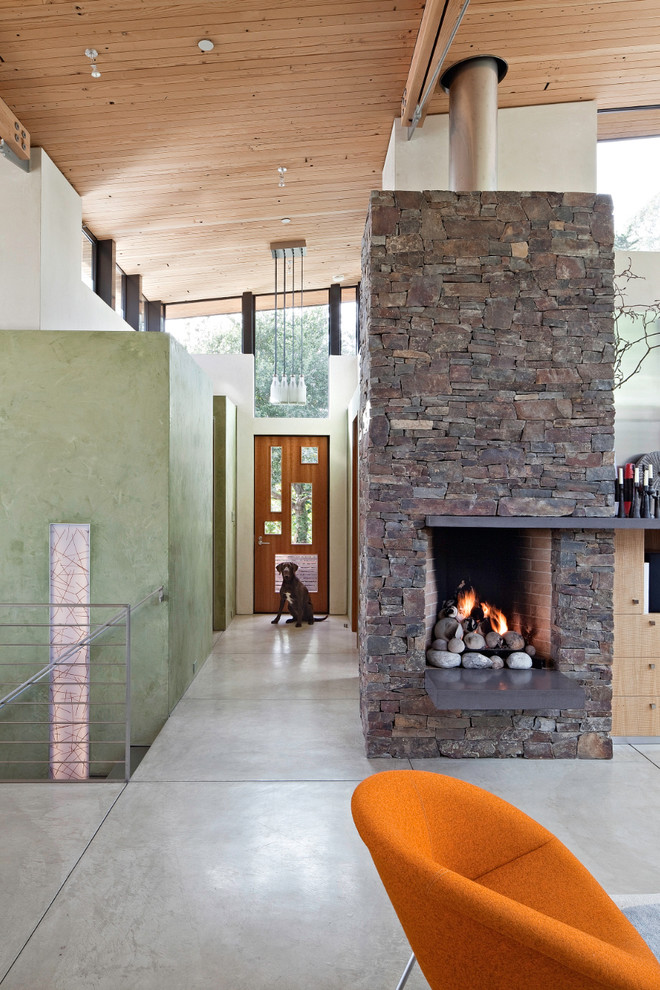 Inspiration for a large coastal concrete floor and gray floor entryway remodel in San Francisco with white walls