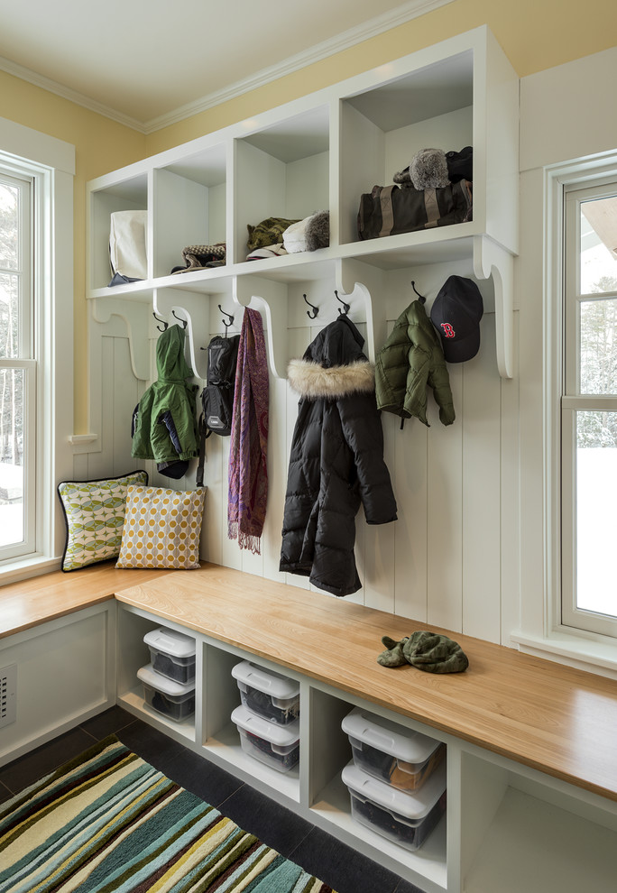 Mudroom - mid-sized traditional slate floor mudroom idea in Portland Maine with yellow walls