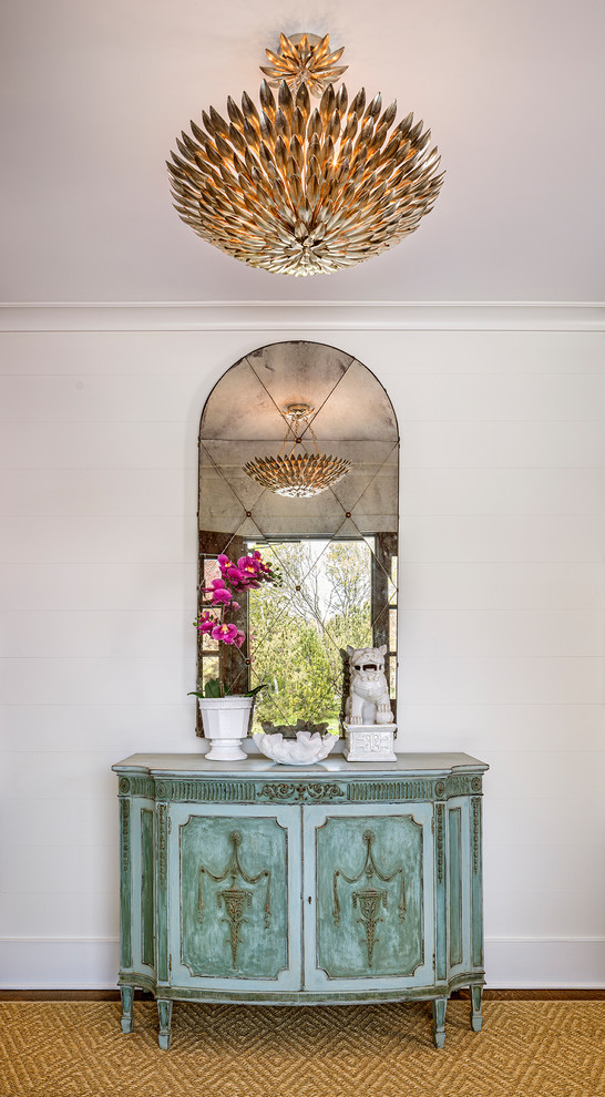 Inspiration for a medium sized traditional entrance in New York with white walls, carpet and beige floors.