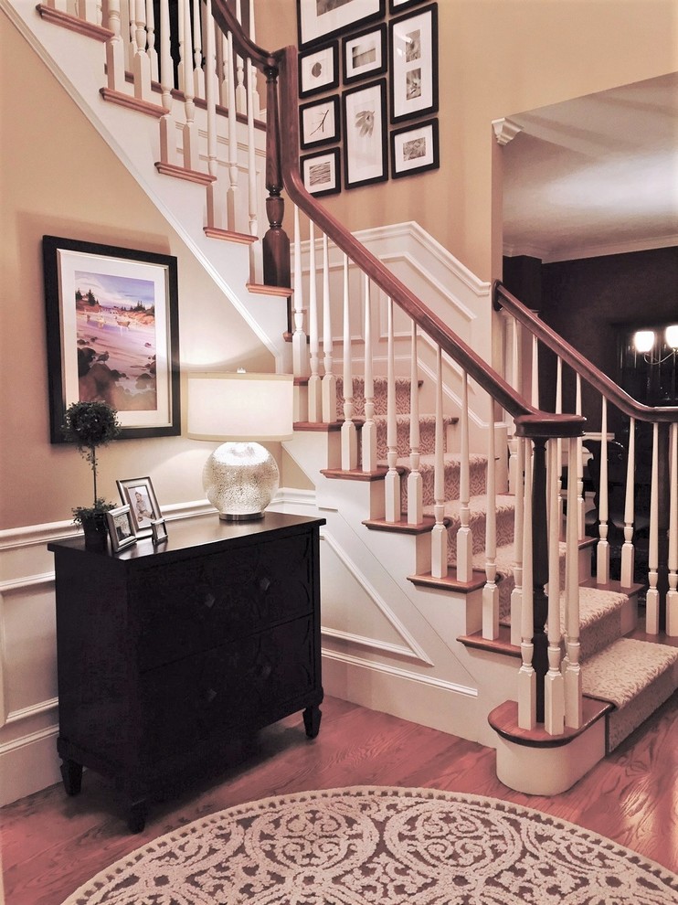 Inspiration for a mid-sized timeless medium tone wood floor entryway remodel with yellow walls