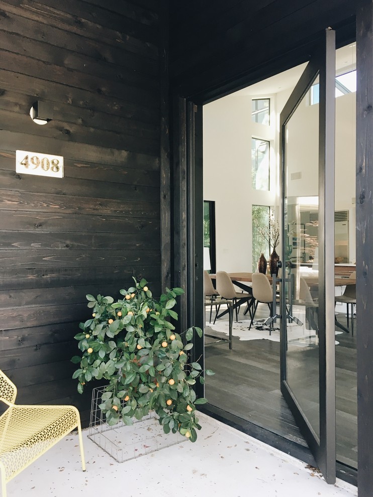 Entryway - contemporary entryway idea in Austin with a glass front door