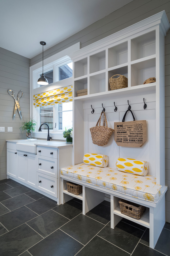 Mudroom - transitional black floor mudroom idea in Portland with gray walls