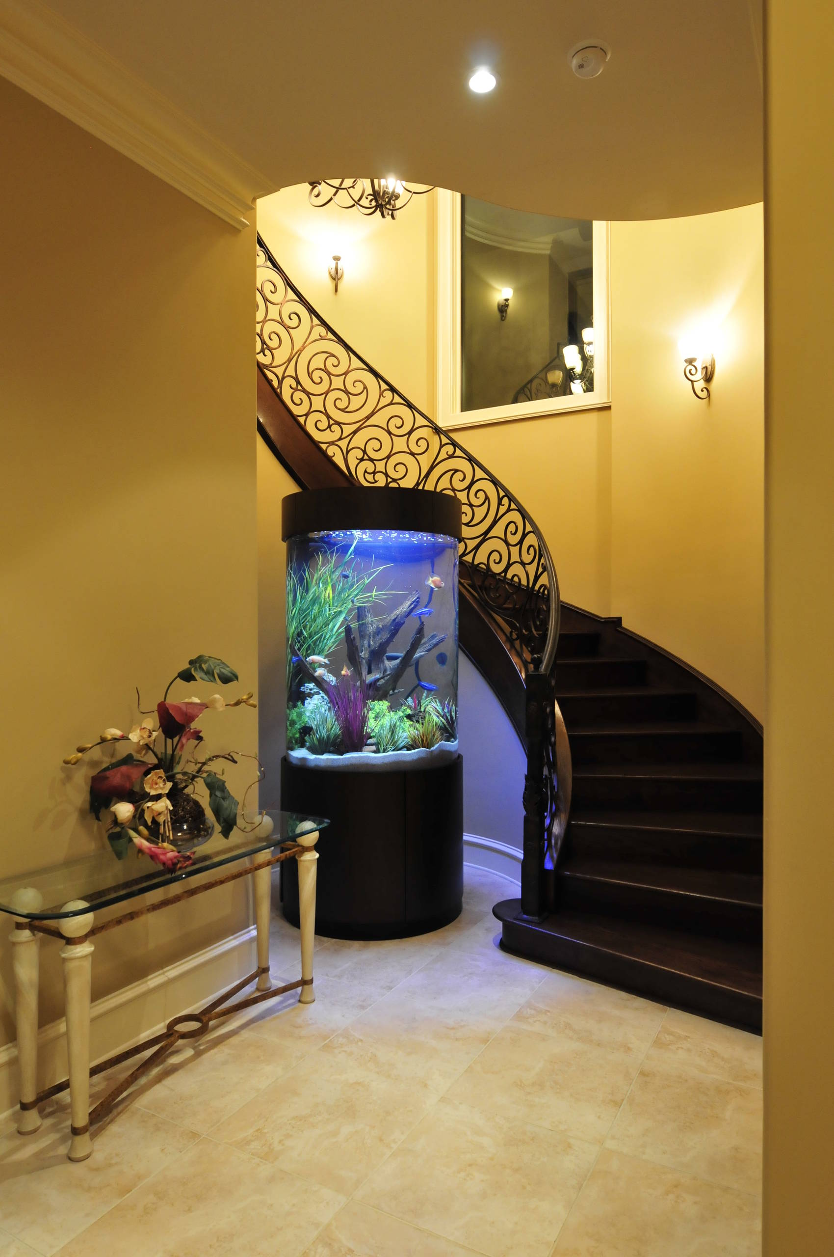 Stunning Cylinder Aquarium with Wrap Around Staircase - Mediterranean -  Entry - Houston - by The Fish Gallery | Houzz