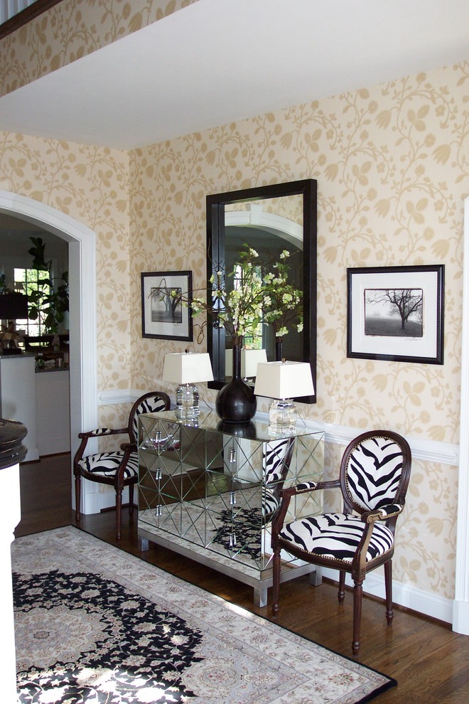 Ornate dark wood floor entryway photo in Richmond with beige walls