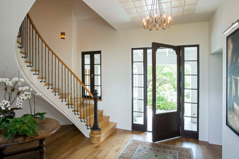 Inspiration for a medium sized classic front door in Charleston with white walls, light hardwood flooring, a single front door and brown floors.