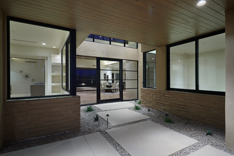 Mittelgroße Moderne Haustür mit beiger Wandfarbe, Travertin, Drehtür und Haustür aus Metall in Phoenix