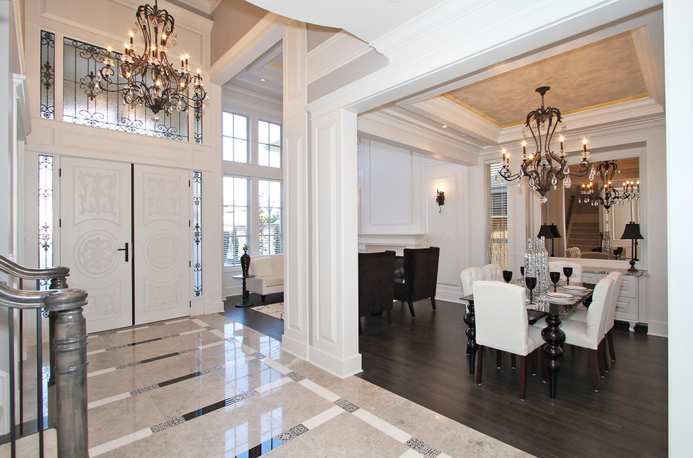 Inspiration for a large traditional foyer in Vancouver with grey walls, porcelain flooring, a double front door and a white front door.