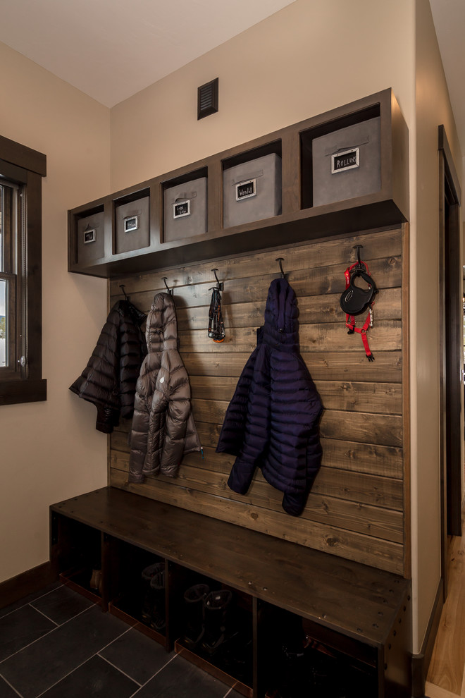 Photo of a small rustic boot room in Denver with beige walls, slate flooring and grey floors.