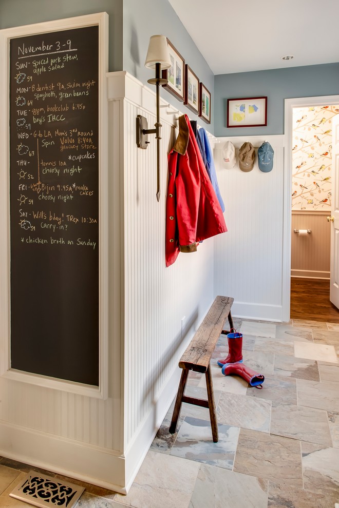 Inspiration for a traditional boot room in Kansas City with white walls.