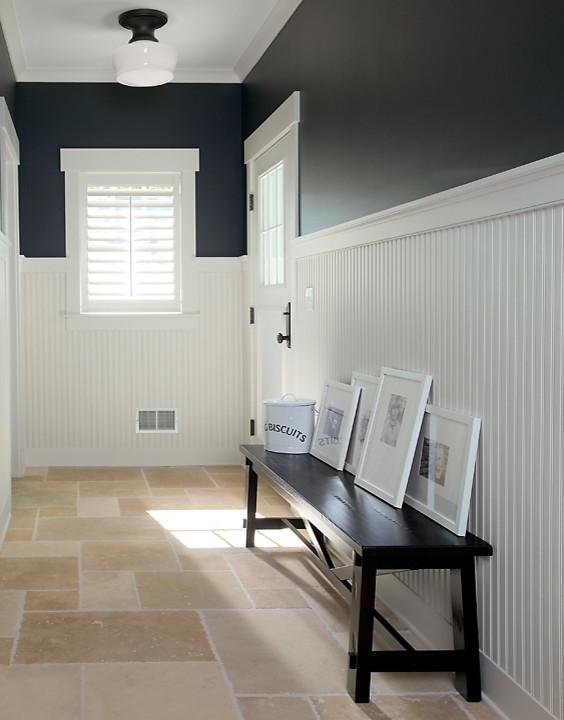 Mid-sized beach style travertine floor and brown floor entryway photo in Grand Rapids with a white front door and multicolored walls
