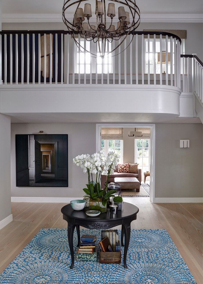 Inspiration for a contemporary light wood floor and beige floor entryway remodel in London