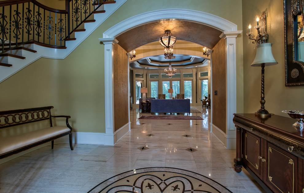 Design ideas for a large classic foyer in Jacksonville with beige walls.
