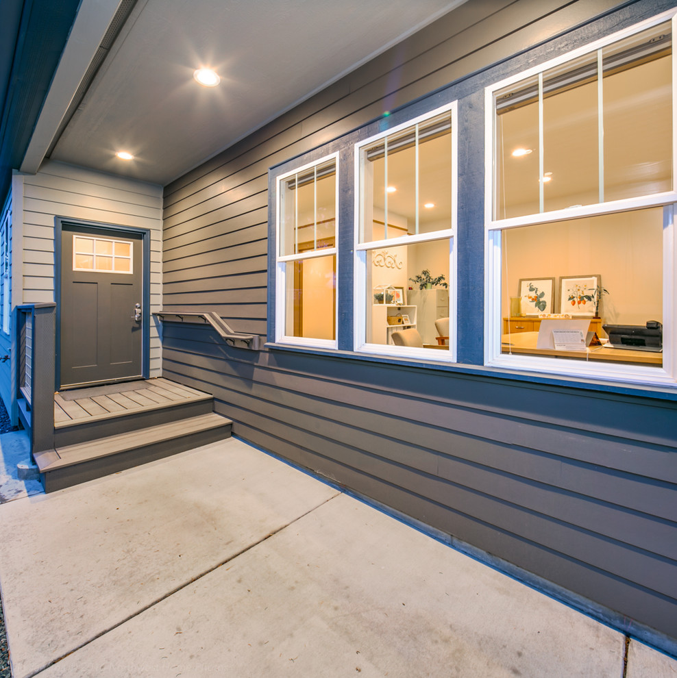 Example of a large classic entryway design in Seattle with a gray front door