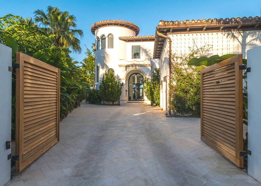 Photo of a large contemporary front door in Miami with white walls and a double front door.