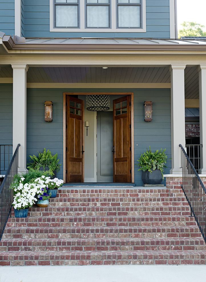 Mid-sized transitional entryway photo in Other with a medium wood front door