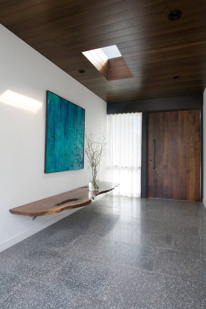 Design ideas for a modern entrance in San Diego with concrete flooring.