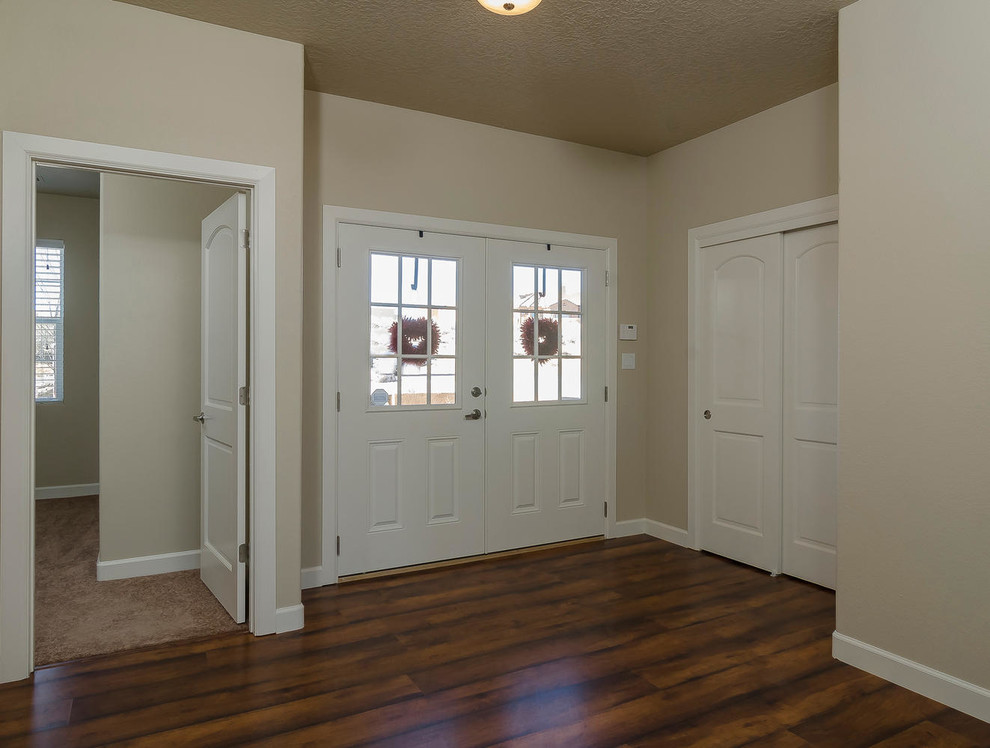 Design ideas for a medium sized foyer in Albuquerque with beige walls, a double front door and a white front door.