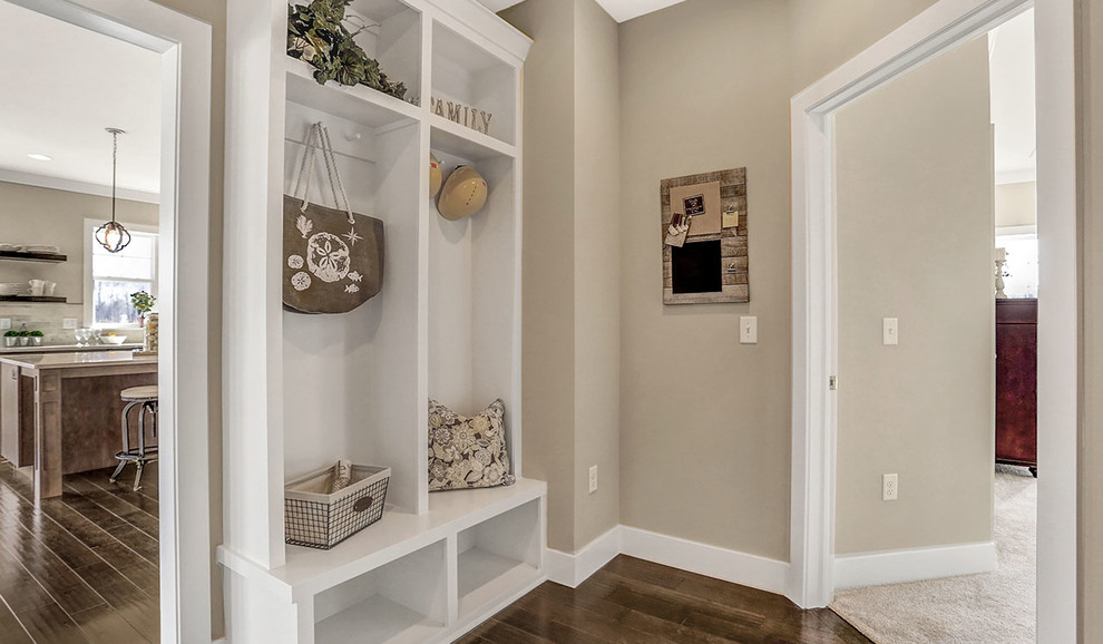 Inspiration for a medium sized traditional boot room in Other with beige walls and dark hardwood flooring.