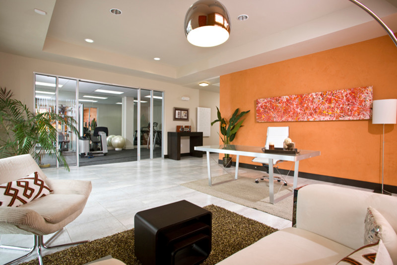 This is an example of a medium sized modern foyer in Las Vegas with orange walls, marble flooring, a double front door and a glass front door.