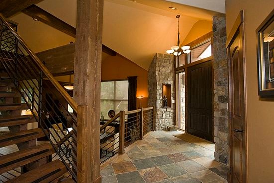 Design ideas for a large traditional foyer in Denver with slate flooring, a single front door and a dark wood front door.