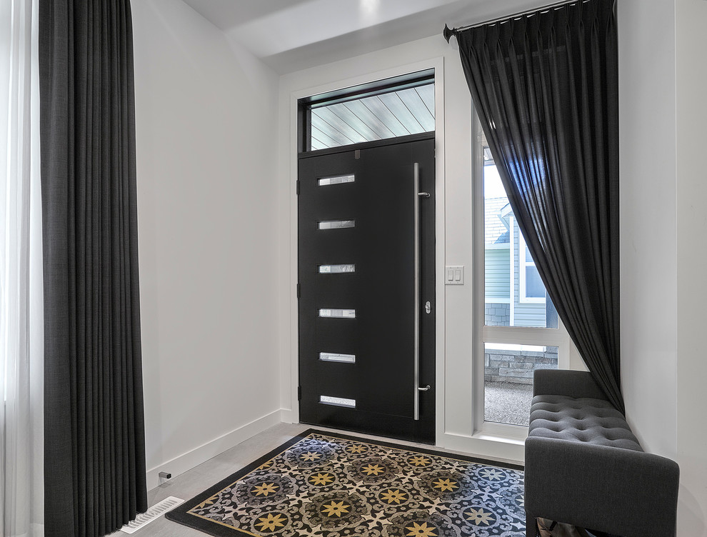 Idee per una porta d'ingresso design di medie dimensioni con pareti bianche, una porta singola e una porta nera