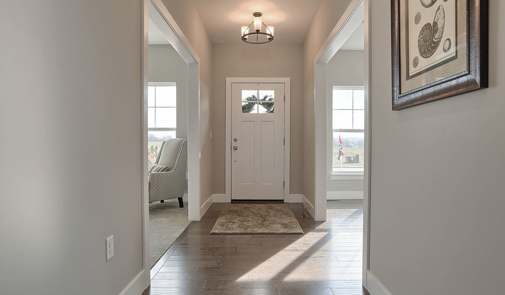 Entryway - large craftsman medium tone wood floor entryway idea in Other with gray walls and a white front door