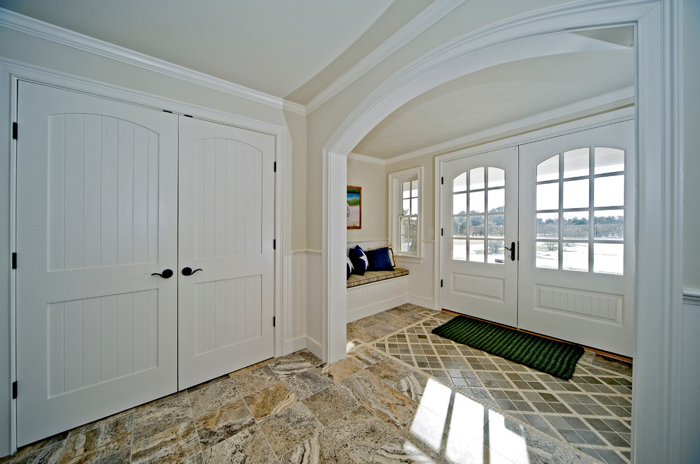 Inspiration for a large eclectic marble floor entryway remodel in Boston with white walls and a white front door