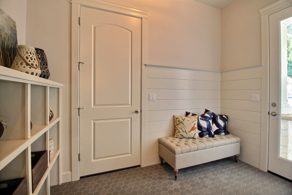 Example of a large arts and crafts porcelain tile and gray floor entryway design in Portland with beige walls and a white front door