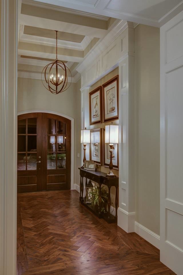 Photo of a large traditional foyer in Orlando with grey walls, a double front door and a dark wood front door.