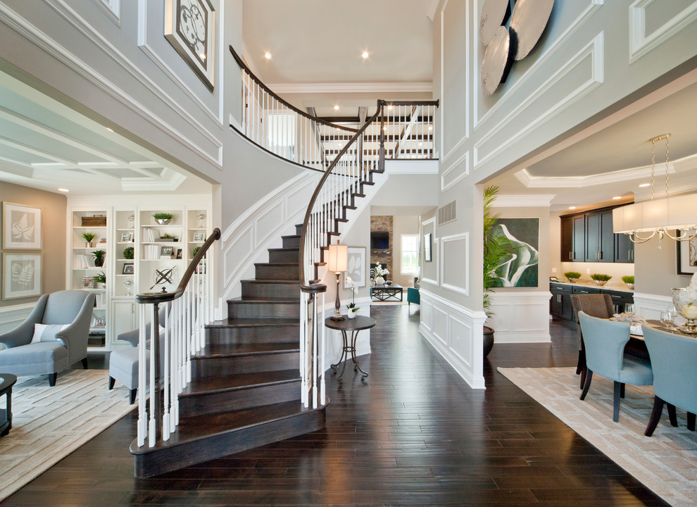 Inspiration for an expansive contemporary foyer in Philadelphia with grey walls and dark hardwood flooring.