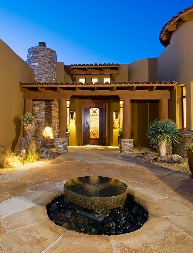 This is an example of an entrance in Phoenix with a single front door and a metal front door.