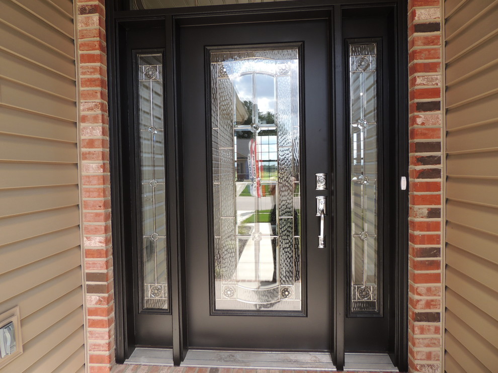 Inspiration for a medium sized traditional front door in St Louis with beige walls, concrete flooring, a single front door and a black front door.