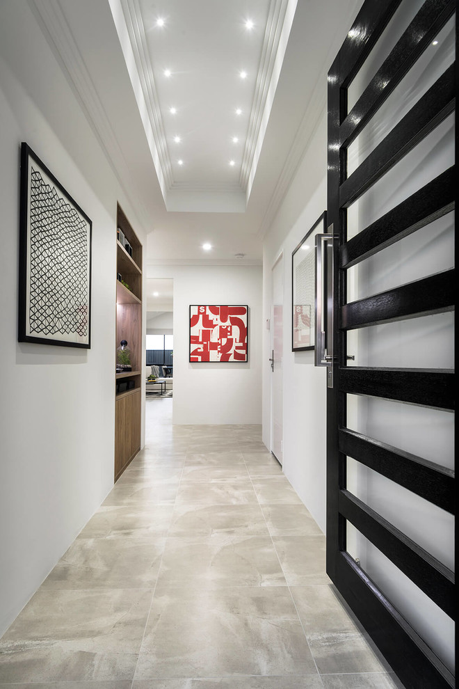 This is an example of a large contemporary hallway in Perth with white walls, porcelain flooring, a single front door, a black front door and beige floors.