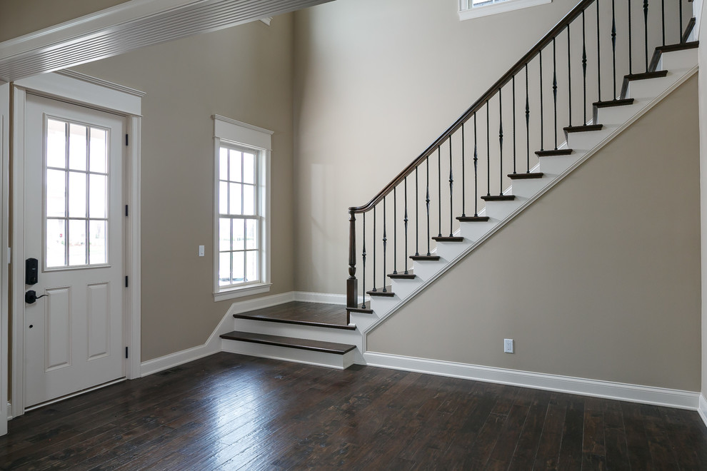 Classic foyer in Louisville with grey walls, dark hardwood flooring, a single front door and a white front door.