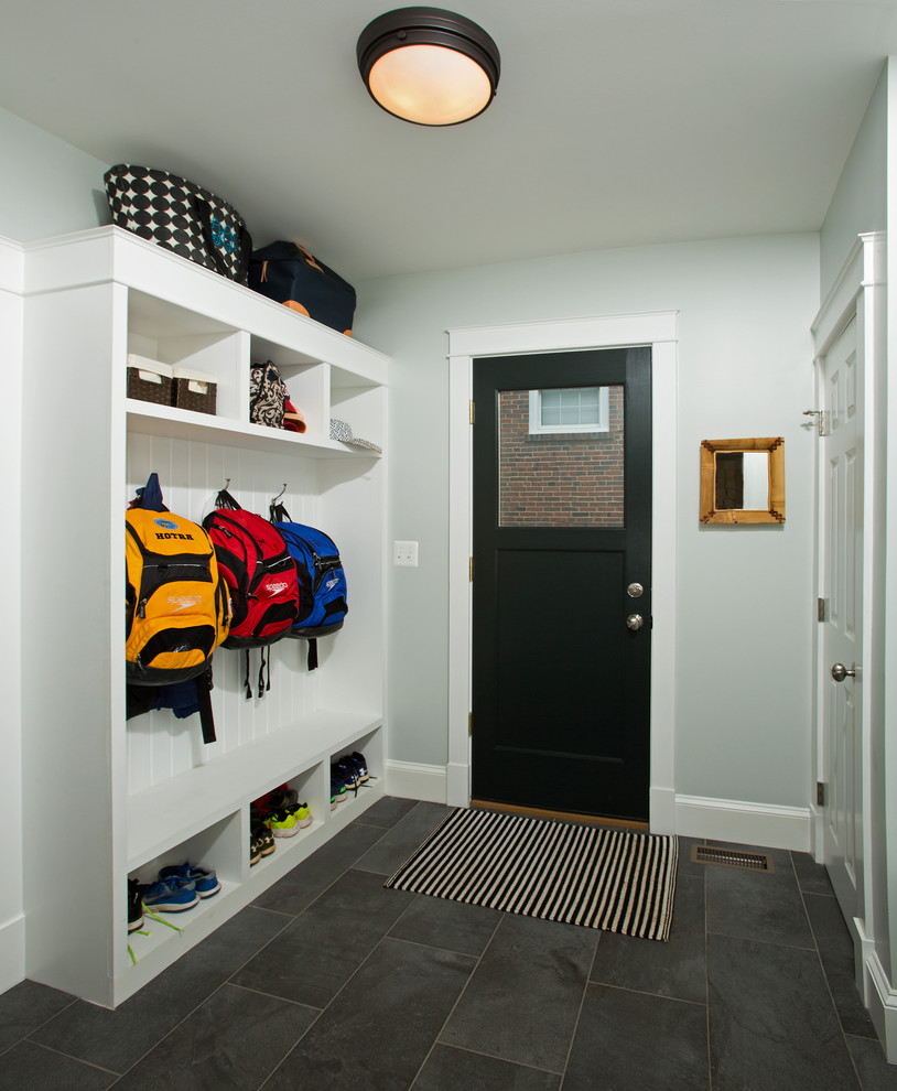 Mid-sized transitional slate floor and gray floor entryway photo in DC Metro with gray walls and a black front door