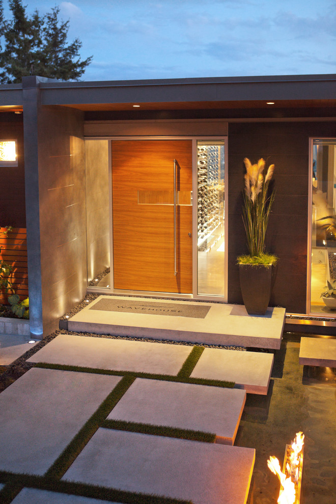 Example of a trendy entryway design in Vancouver with a medium wood front door