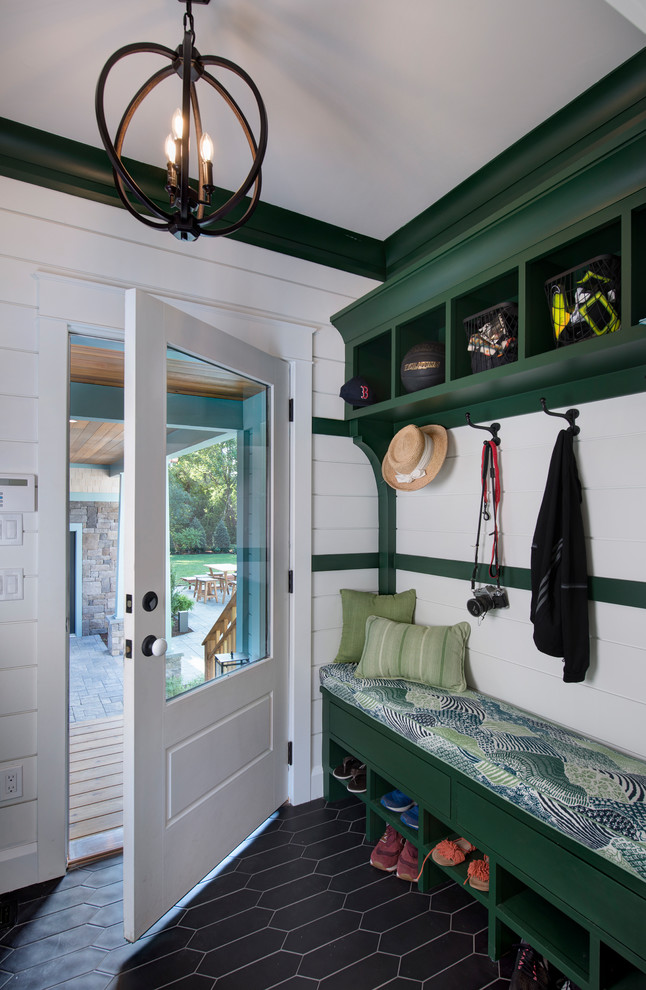 Entryway - cottage black floor entryway idea in Other with white walls and a white front door