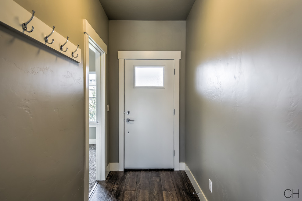 Small arts and crafts single front door photo in Boise with gray walls and a blue front door