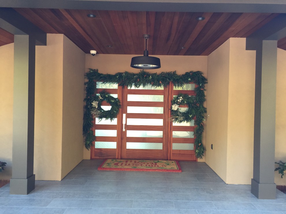 Photo of a large contemporary front door in San Francisco with beige walls, ceramic flooring, a single front door and a medium wood front door.