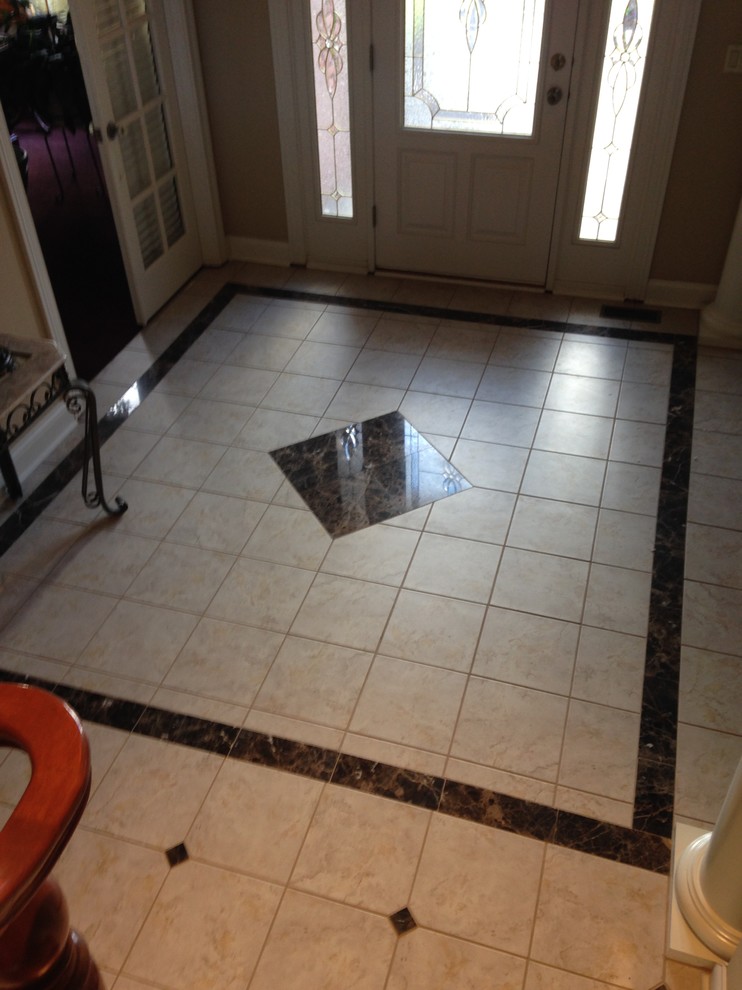 This is an example of a medium sized classic foyer in Cleveland with beige walls, ceramic flooring, a single front door and a white front door.